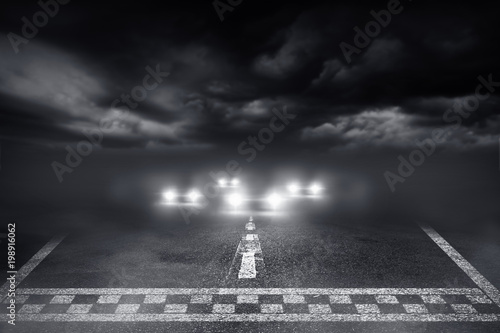 Finish line racing car driving the fog road