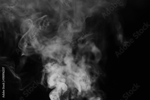 White smoke on a black background. Texture of smoke. Clubs of wh