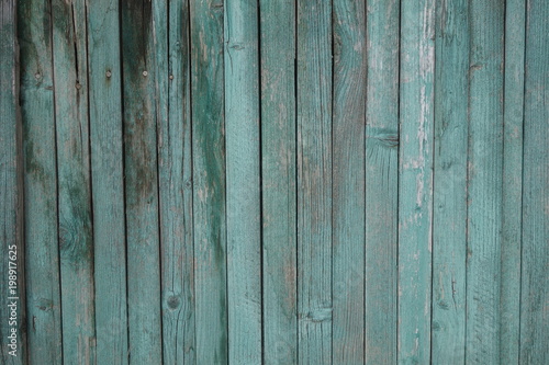 Wall texture background with peeling old paint. Old plank wooden wall background.