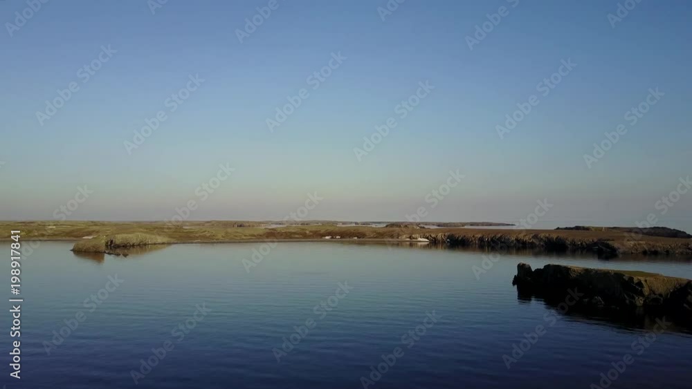 Panorama of cold wilderness of Arctic Ocean on New Earth Vaigach Russian North. Beautiful landscape of wild nature. Quiet and calm ecotourism. Wildlife on background of desert. Panorama of cold wilderness of Arctic Ocean on New Earth Vaigach Russian North. Beautiful landscape of wild nature. Quiet and calm ecotourism. Wildlife on background of desert.