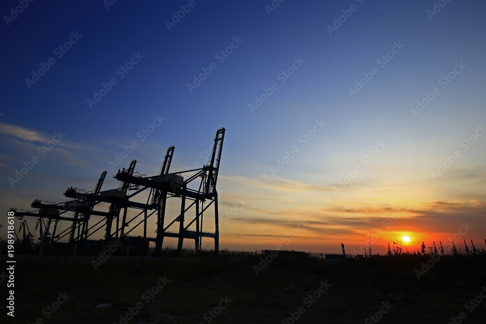 Port crane unloading container ships Port crane unloading container ships