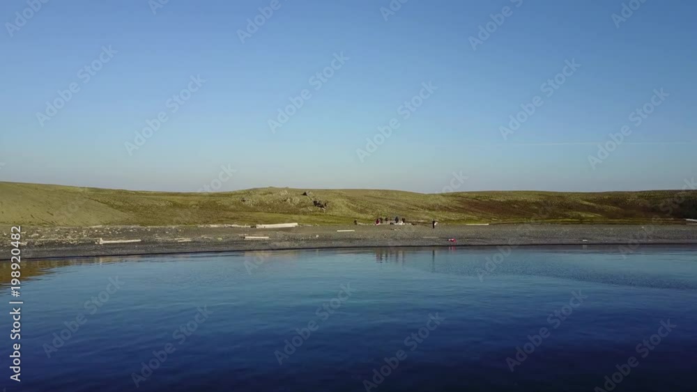 People on cold wilderness view from drone on New Earth Vaigach Russian North. Beautiful landscape of wild nature. Quiet and calm ecotourism. Wildlife on background of desert. People on cold wilderness view from drone on New Earth Vaigach Russian North. Beautiful landscape of wild nature. Quiet and calm ecotourism. Wildlife on background of desert.
