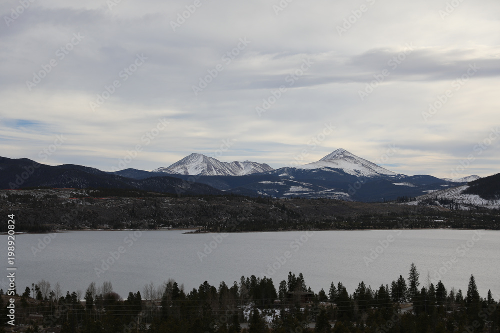 Beautiful lake and frozen mountains on a cloudy day