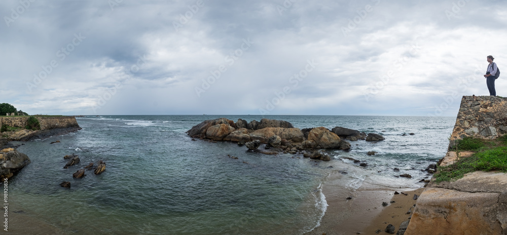 Landscape view on rocky coast ocean in Galle Srilanka in cloudy weather Landscape view on rocky coast ocean in Galle Srilanka in cloudy weather