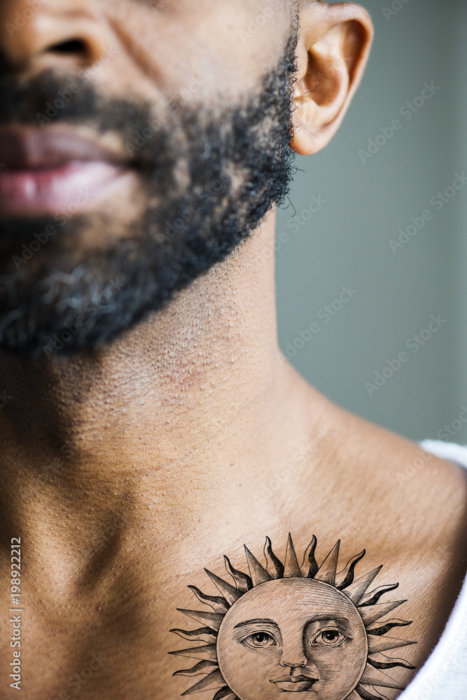 Closeup of collar bone tattoo of a man Stock Photo