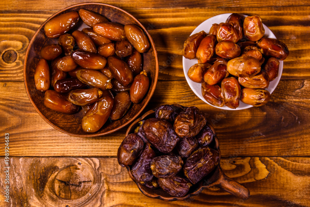 Date fruits on a wooden table. Top view Date fruits on a wooden table. Top view