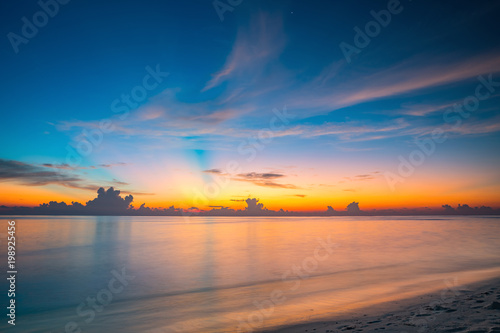 Calm sunset over ocean on Maldives