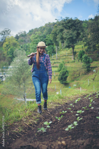 farmer woman .Planting trees in the garden