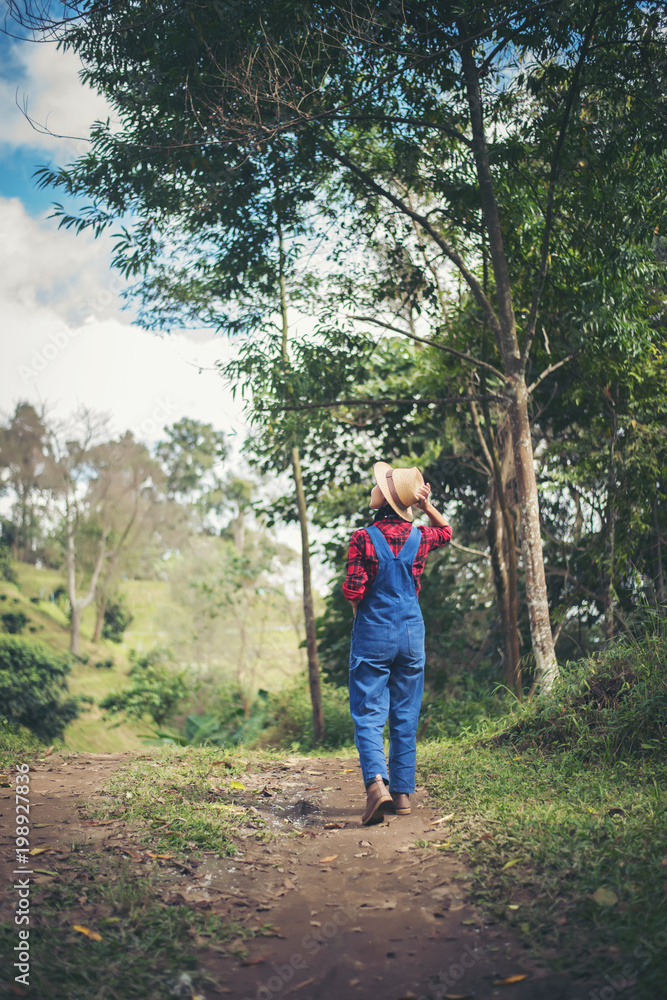 young woman walking in the forest