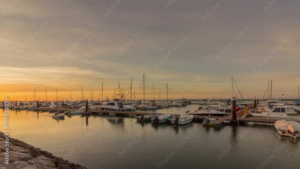 Sunrise pan timelapse seascape view of Olhao Marina, waterfront to Ria Formosa natural park. Algarve. Sunrise pan timelapse seascape view of Olhao Marina, waterfront to Ria Formosa natural park. Algarve.