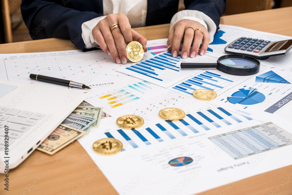 woman working at office - bitcoin business graph laptop and dollar woman working at office - bitcoin business graph laptop and dollar