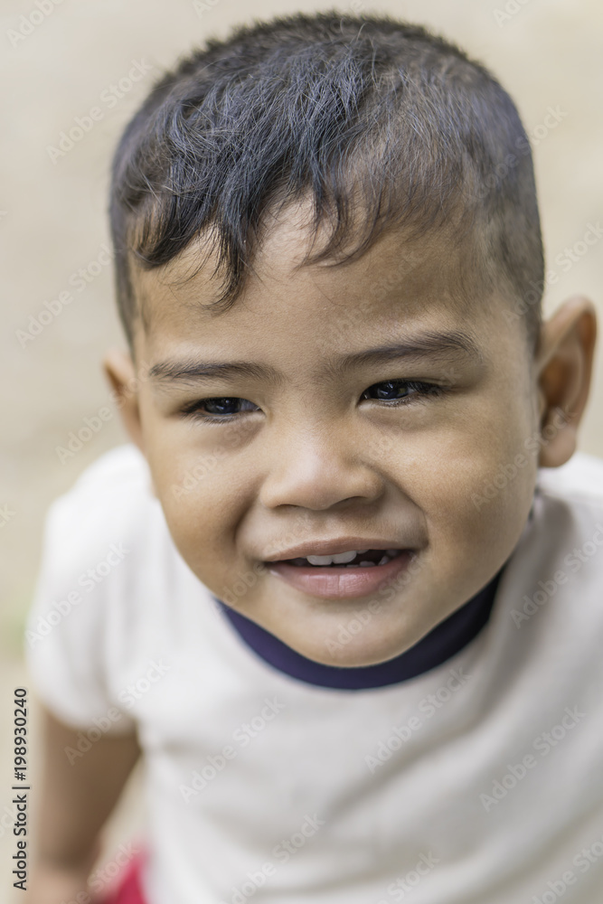 Face close up of boy mix race smiling Face close up of boy mix race smiling