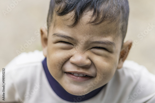 Face close up of boy mix race smiling