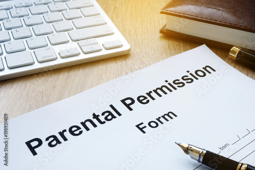 Parental Permission Form on a wooden table.