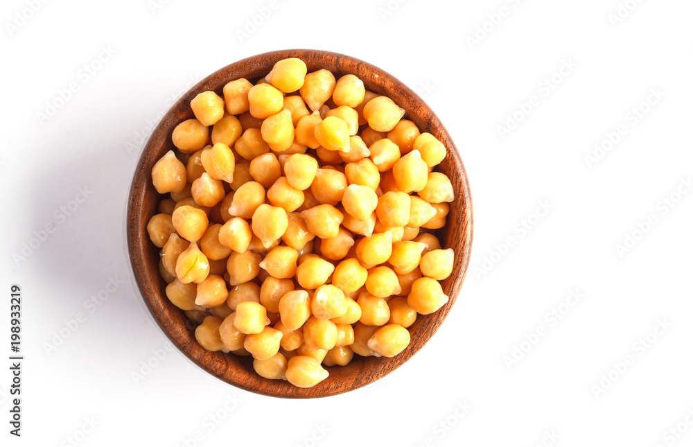 Wooden bowl of preserved (boiled) chickpeas isolated on white background, top view