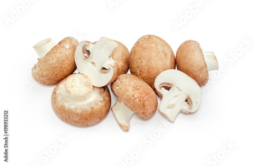 Cultivated brown mushrooms on a white background