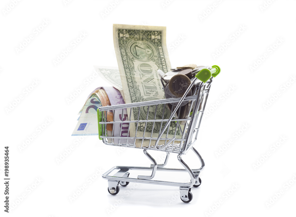 shopping cart full of money banknotes and coins for shopping. isolated on white