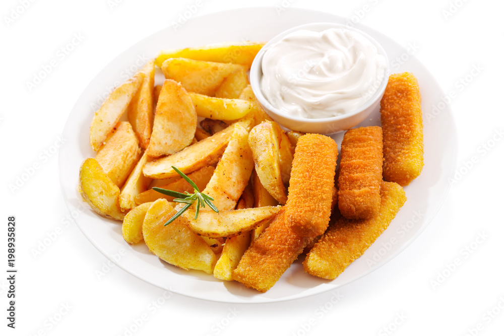 plate of fish sticks with fried potatoes on white background plate of fish sticks with fried potatoes on white background