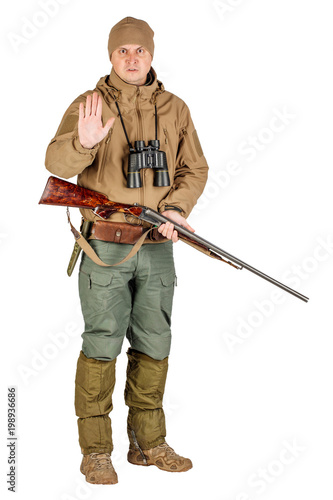 Full length portrait of a male hunter with stop gesture Isolated on white background. hunting and people concept.
