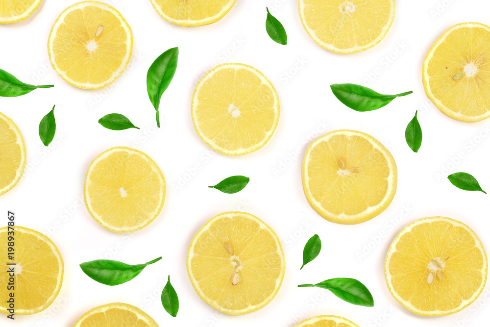 Slices lemon decorated with green leaves isolated on white background. Flat lay, top view
