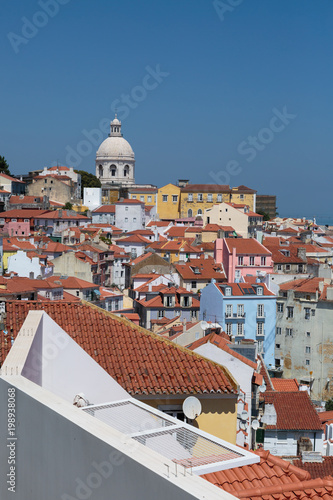 Colorful Houses in Lisbona and Dome of National Pantheon of Santa Engracia - Portugal photo