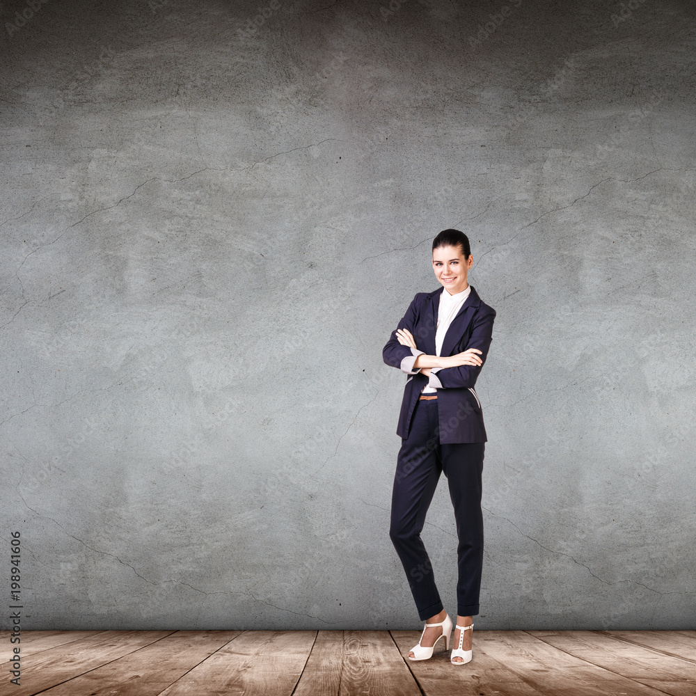 Young successful businesswoman with crossed hands Young successful businesswoman with crossed hands