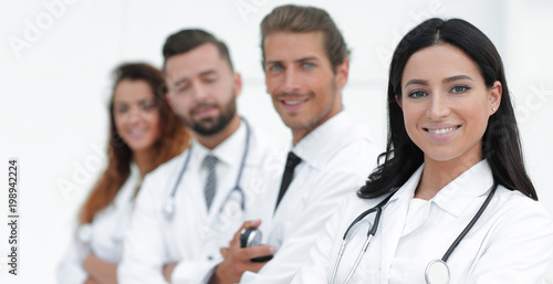 woman doctor on the background of colleagues