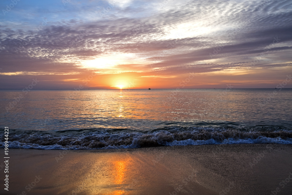 Obraz premium amazing sunset and silhouette of ships on a tropical island