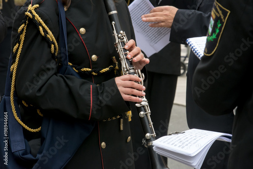 Horizontal View of Close Up of Musician Playing Clarinet in Black Uniform. Taranto, South of Italy