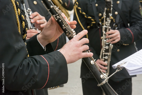 Horizontal View of Close Up of Musicians Playing Clarinet in Black Uniform. Taranto, South of Italy