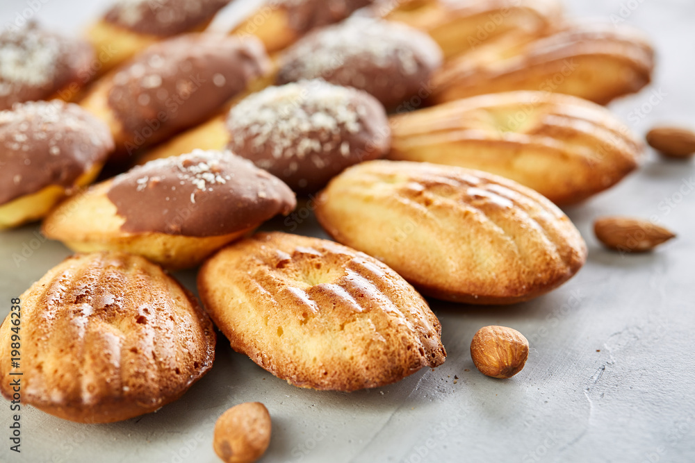 Tasty almond cookies arranged in the shape of fan on white background, close-up, selective focus