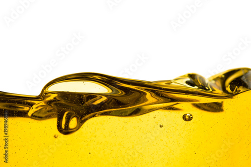 Pouring oil car motor or olive vegetable cooking and bubble isolated on white background