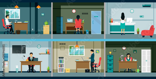 Workers are working in the office with desks and computers.