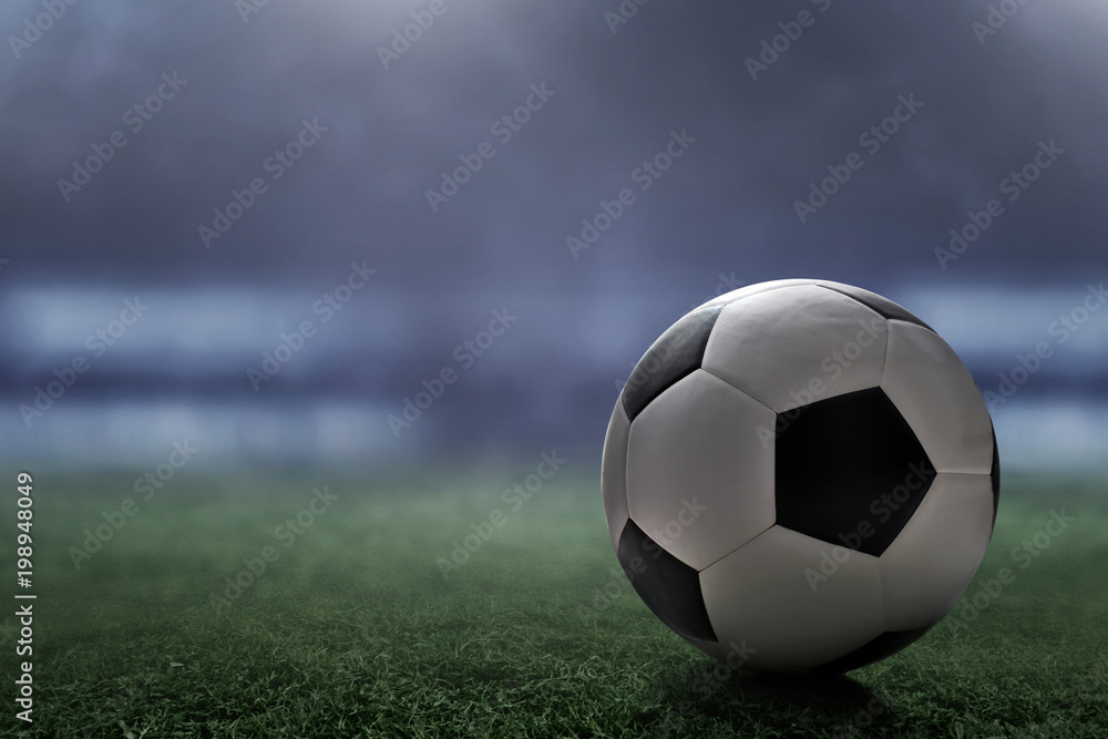 Fototapeta Soccer ball on the field