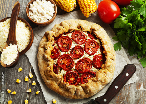 Corn galette  with cottage cheese and tomatoes photo