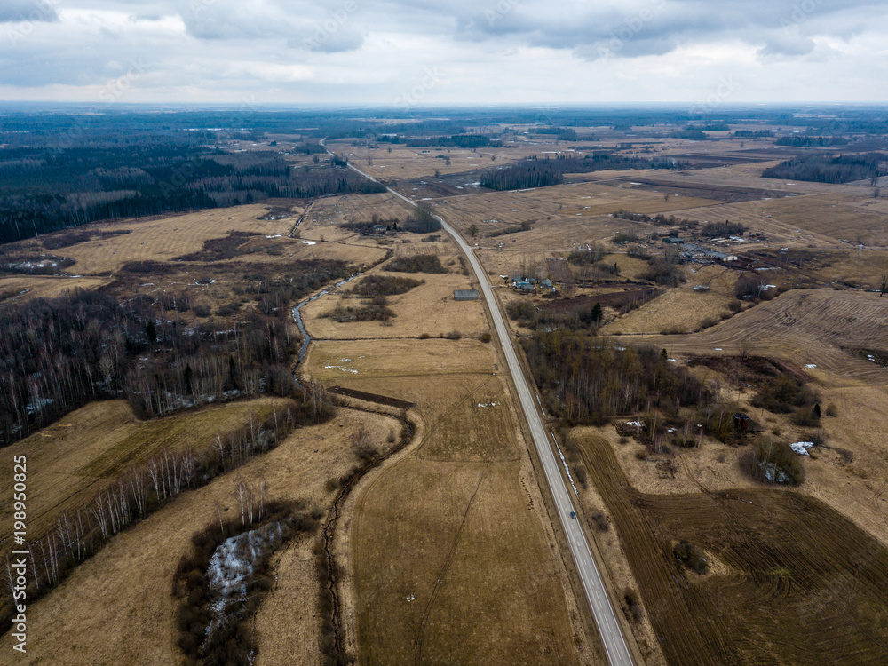 drone image. aerial view of rural area with houses and road network. populated area Dubulti near Jekabpils, Latvia