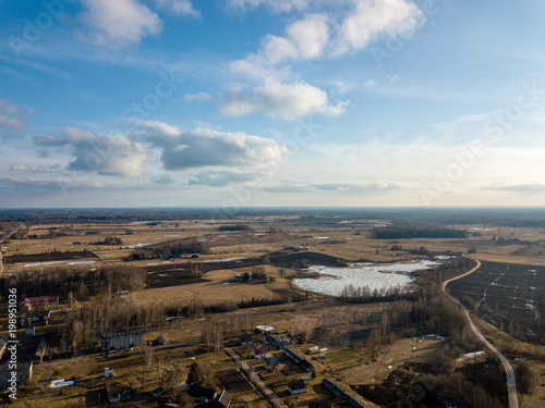 drone image. aerial view of rural area with houses and road network. populated area Dubulti near Jekabpils, Latvia