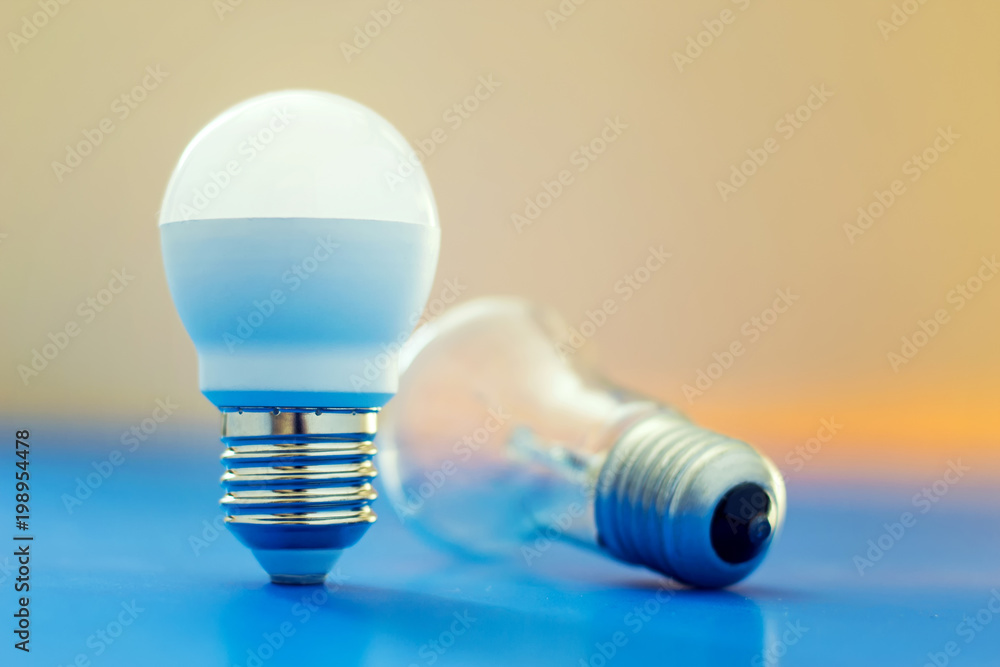 Led light bulb lay next to incandescent bulb Led light bulb lay next to incandescent bulb