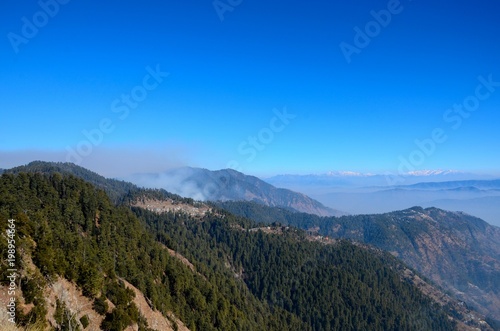 Murree   Nathia Gali  Pakistan - January 12  2018  A distant view of Himalayan mountain range between the Pakistani towns of Murree and Nathia Gali. Both towns are popular tourist spots. 