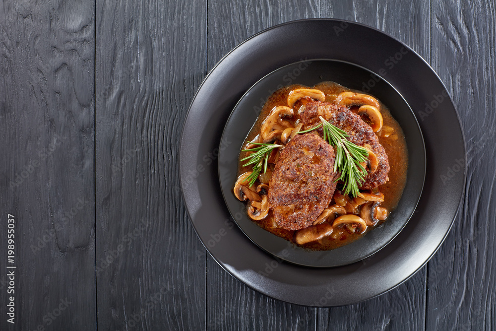 salisbury steaks on plate, top view salisbury steaks on plate, top view