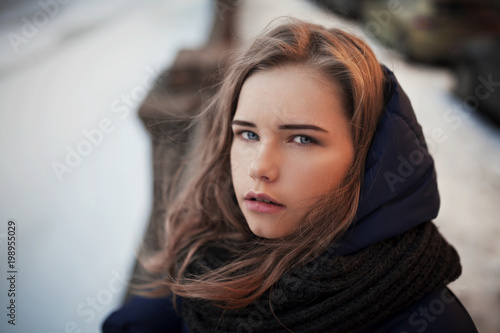 portrait of a girl on the street in winter