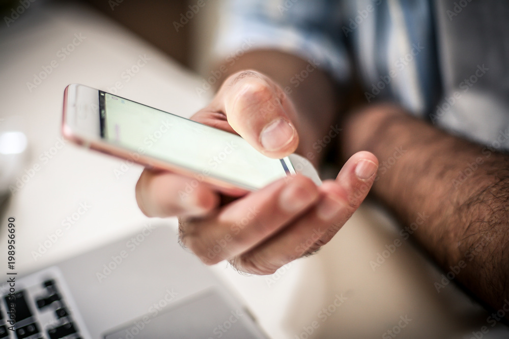 Mobile phone in hand. Mobile phone in hand.