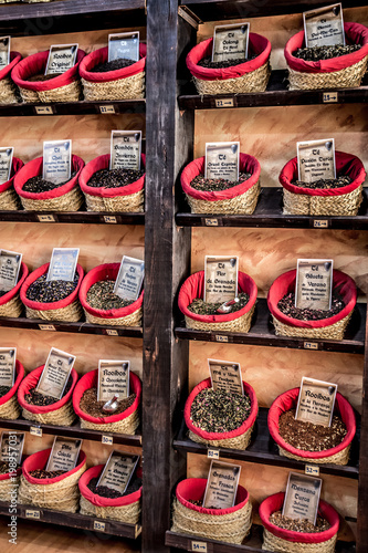 Spices, seeds and tea sold in a traditional market in Granada, Spain