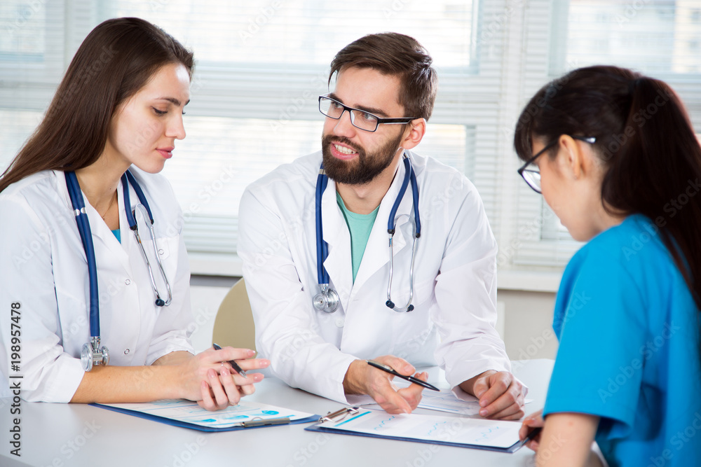 Group of doctors in the clinic Group of doctors in the clinic
