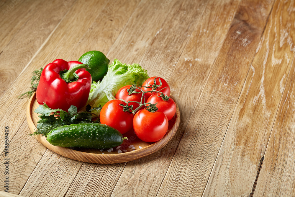 Artistic still life of assorted fresh vegetables and herbs on rustic wooden background, top view, selective focus. Artistic still life of assorted fresh vegetables and herbs on rustic wooden background, top view, selective focus.