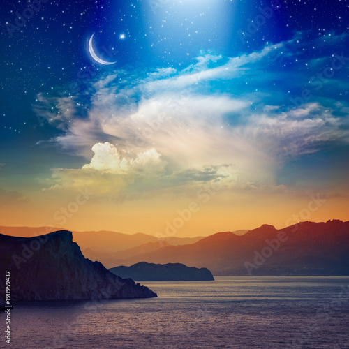 Ramadan Kareem background with crescent, stars and glowing clouds