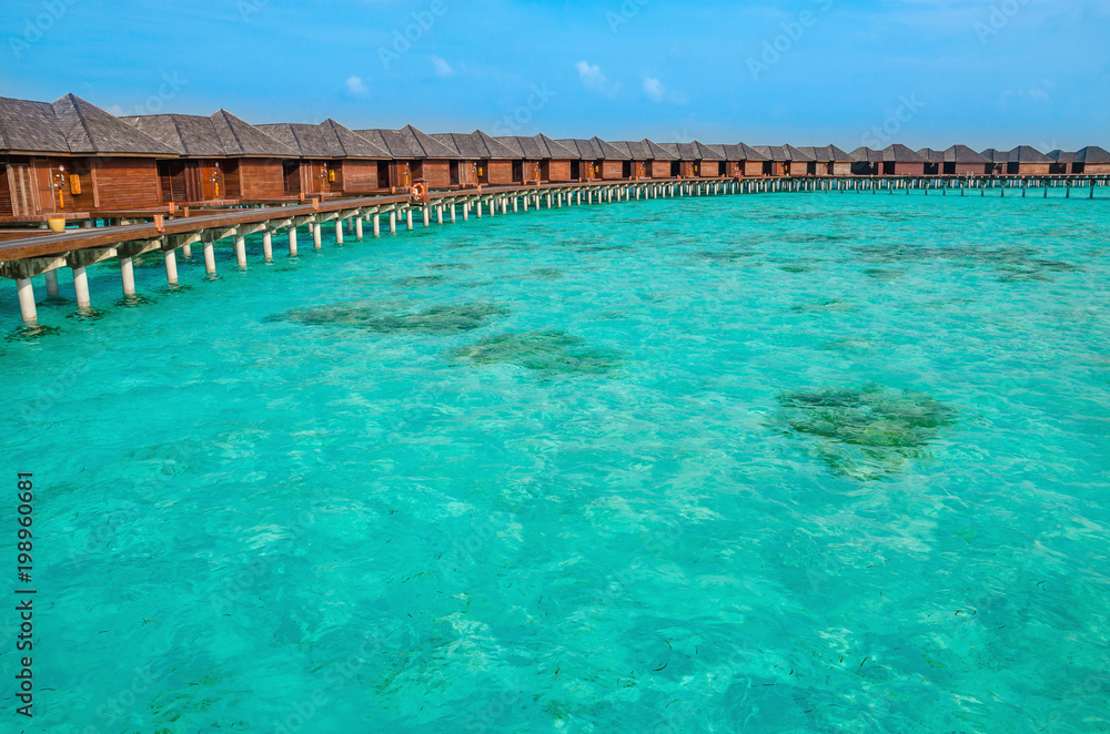 Over water bungalows on a tropical island, Maldives