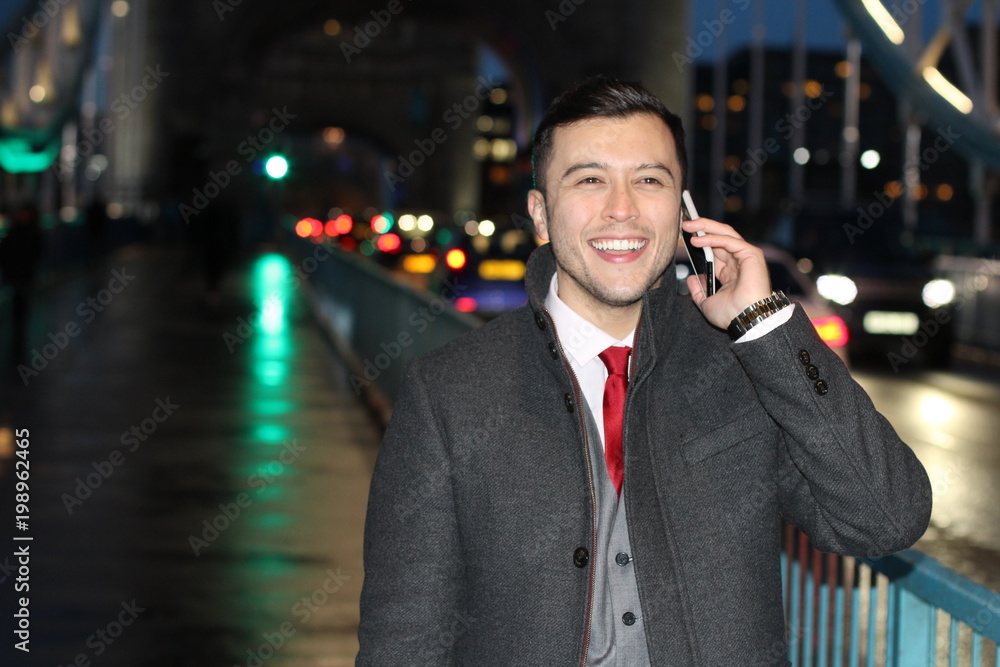 Elegant ethnic businessman calling by phone Elegant ethnic businessman calling by phone
