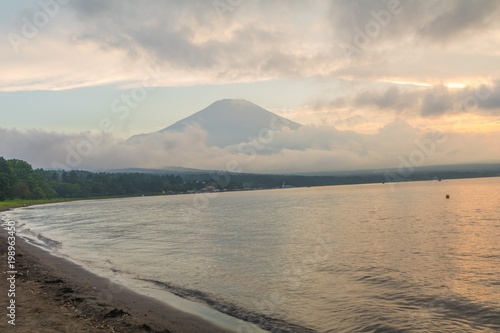  Mt. Fuji and sunset with sun rays at Lake Kawaguchiko, the most famous place in Japan to traveling in Yamanashi Prefecture, Japan