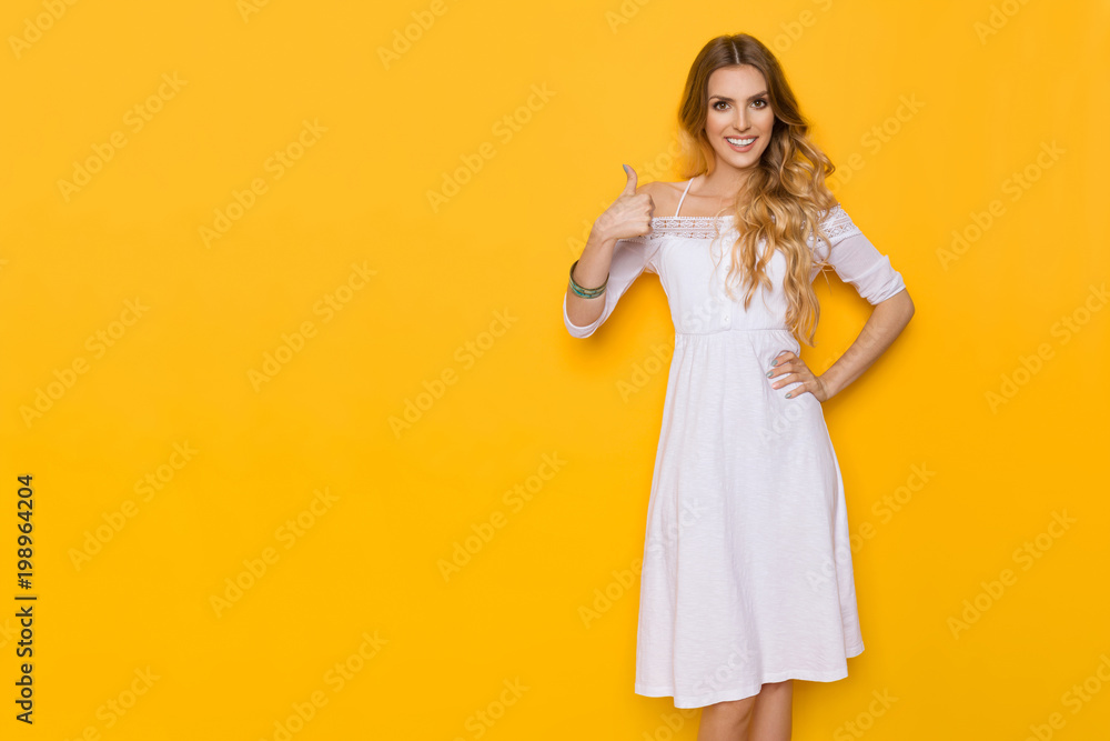 Smiling Elegant Woman In White Dress Gives Thumb Up Smiling Elegant Woman In White Dress Gives Thumb Up
